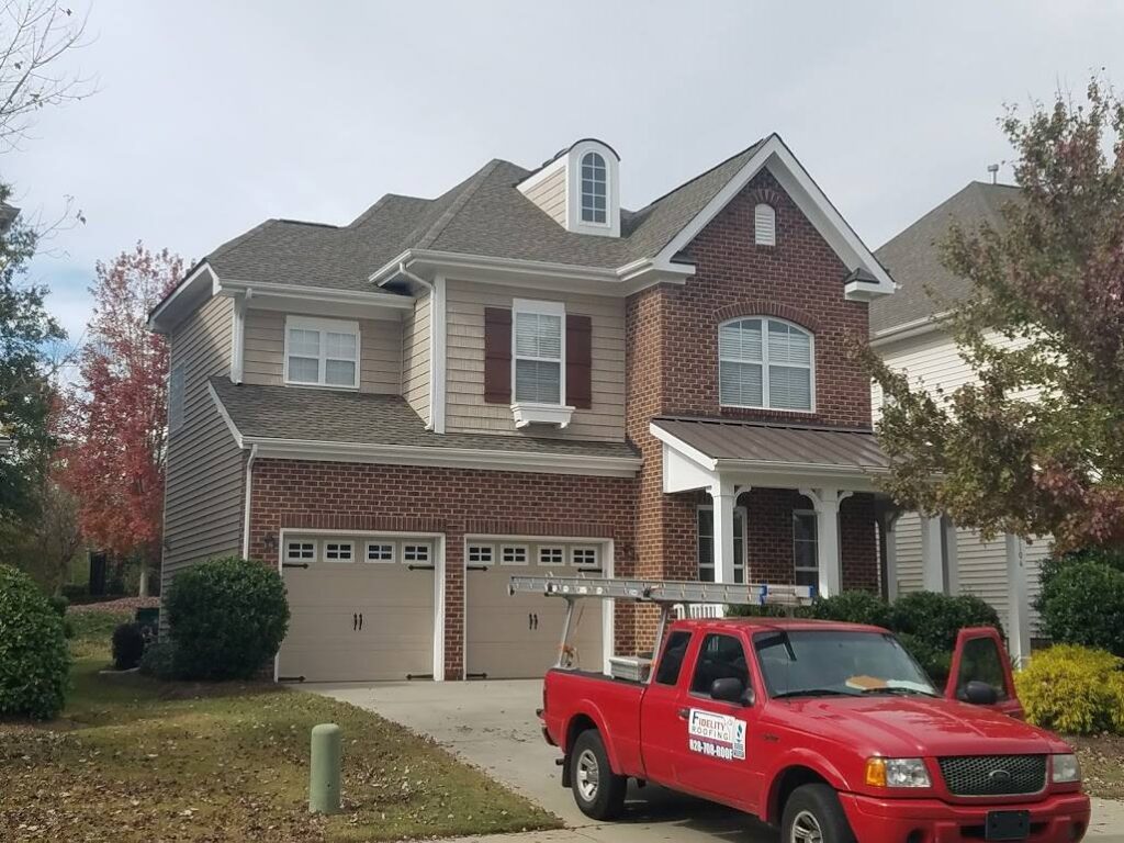 Home with asphalt shingle roof in Geo City